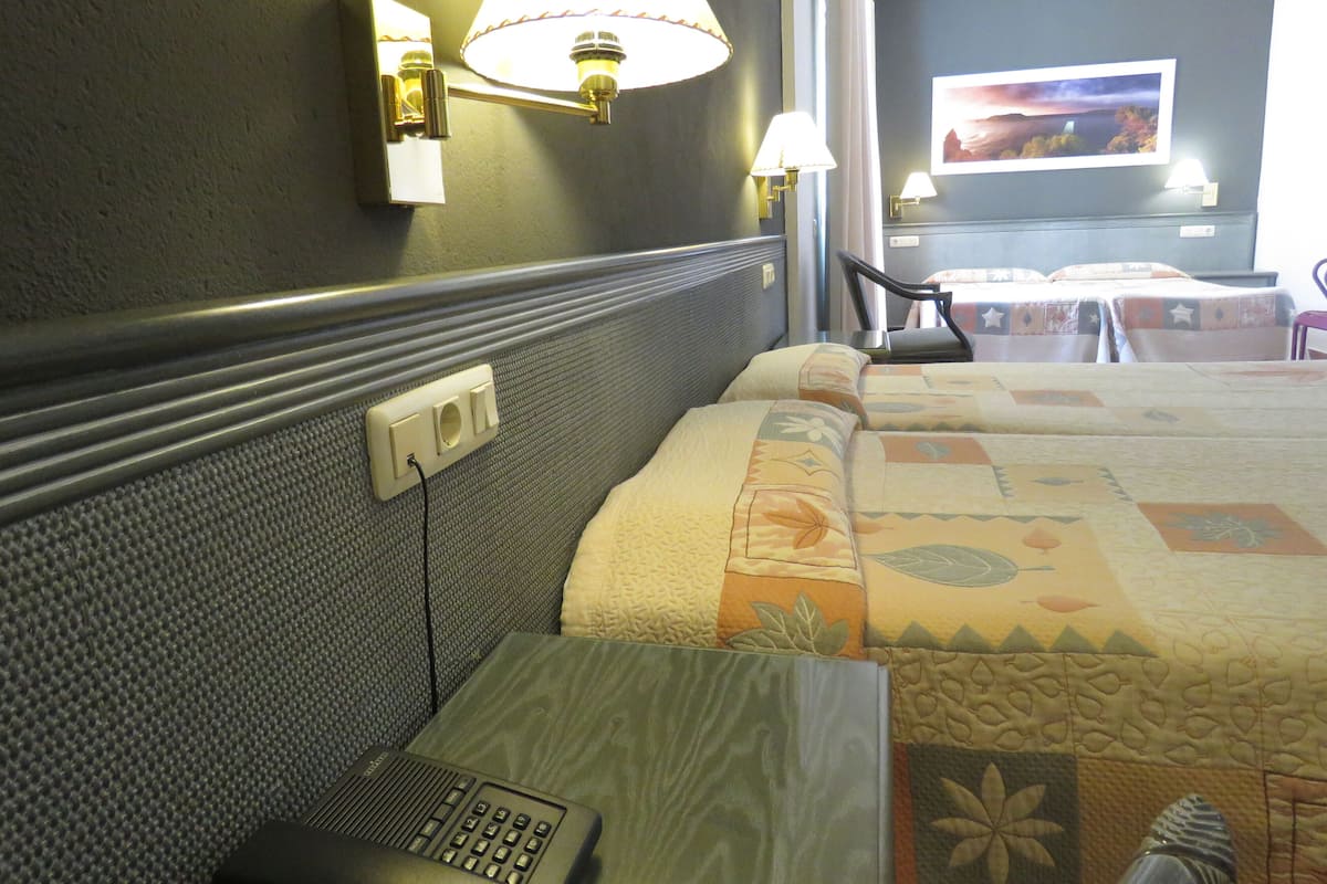 Quadruple Room | Minibar, in-room safe, desk, laptop workspace