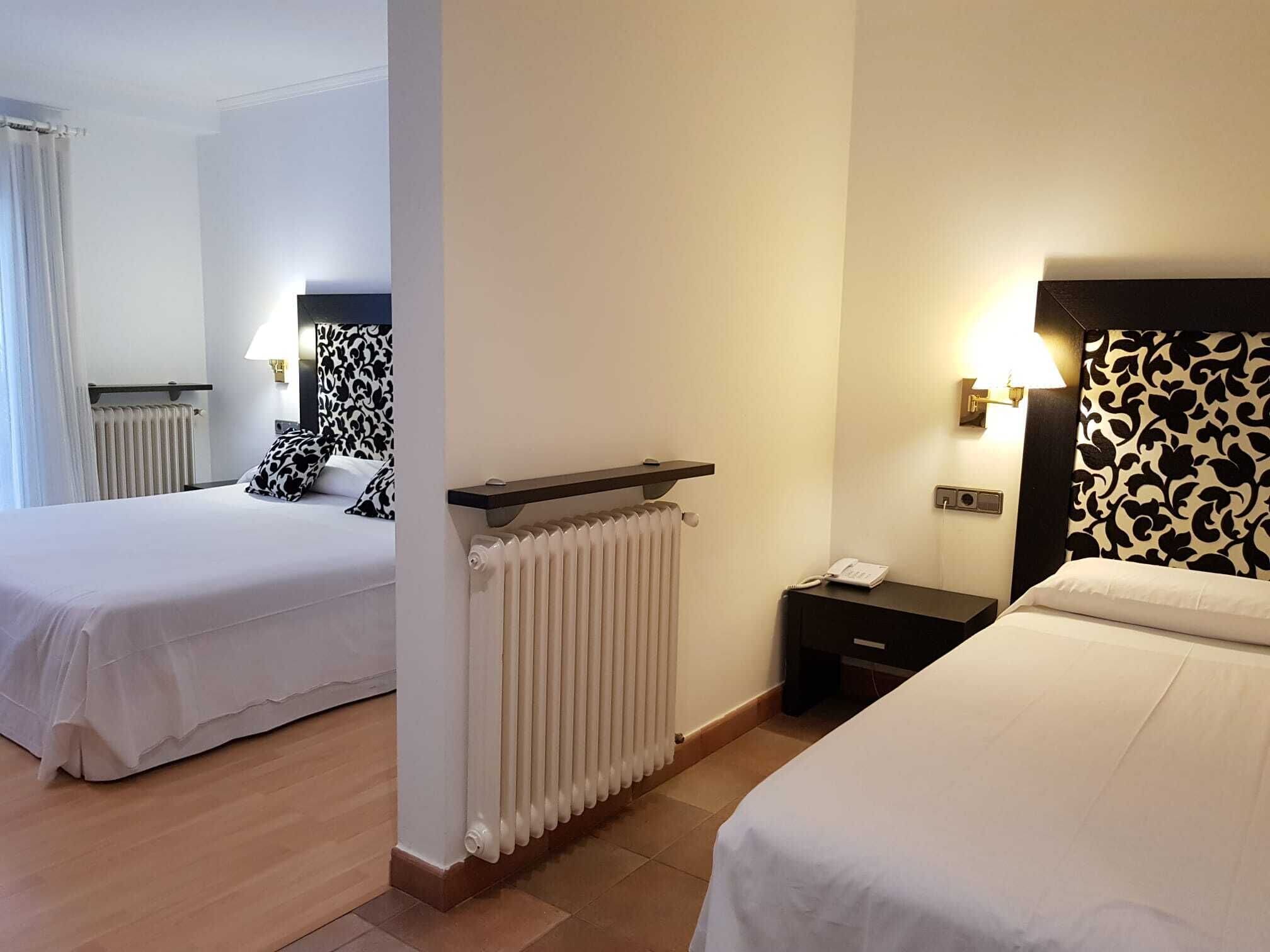 Triple Room | Minibar, in-room safe, desk, laptop workspace