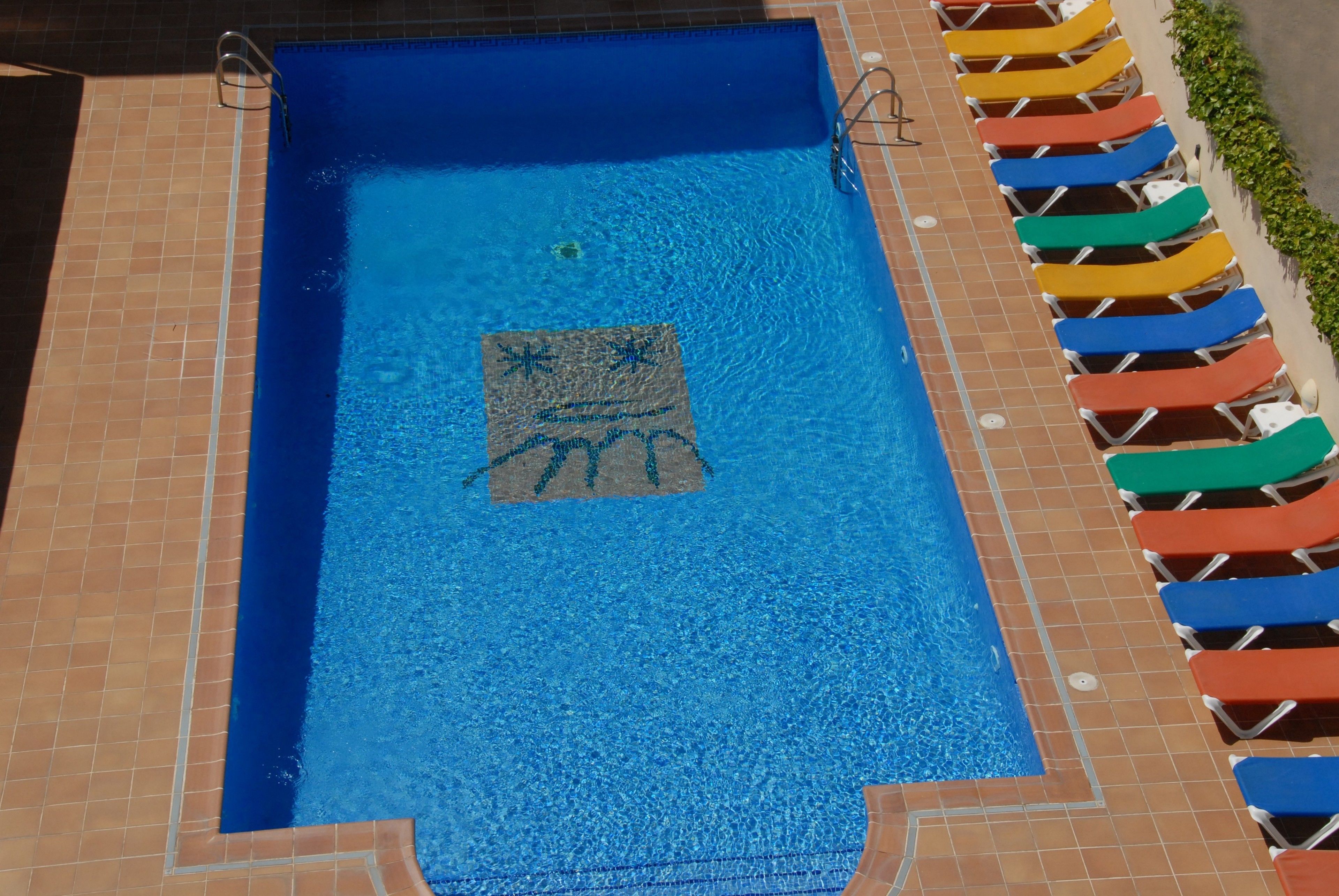 seasonal outdoor pool, pool umbrellas, pool loungers