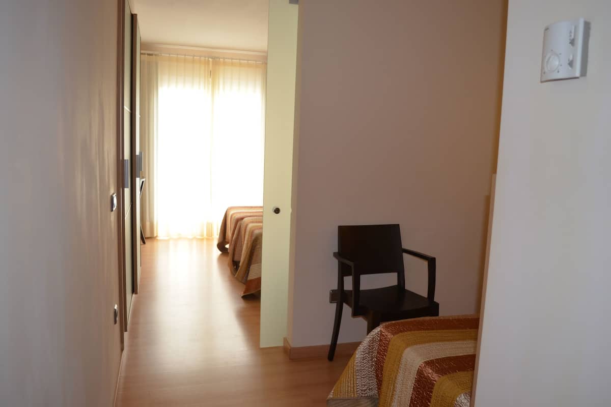 Triple Room | Minibar, in-room safe, desk, laptop workspace