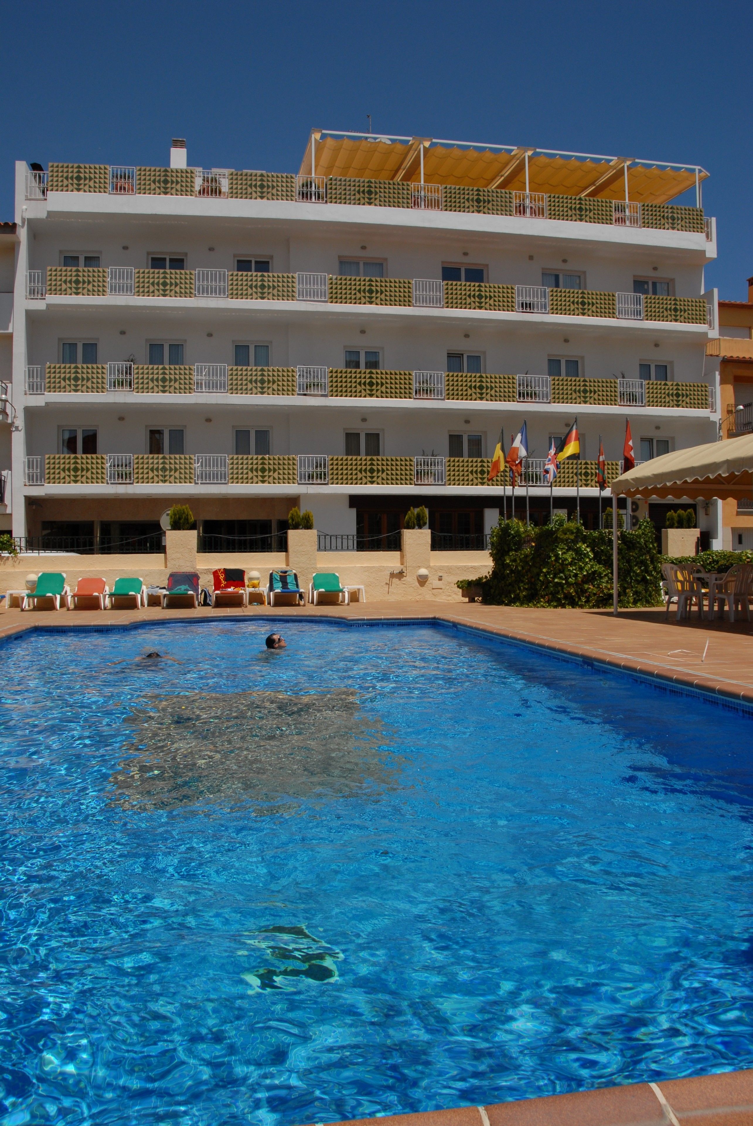 seasonal outdoor pool, pool umbrellas, pool loungers