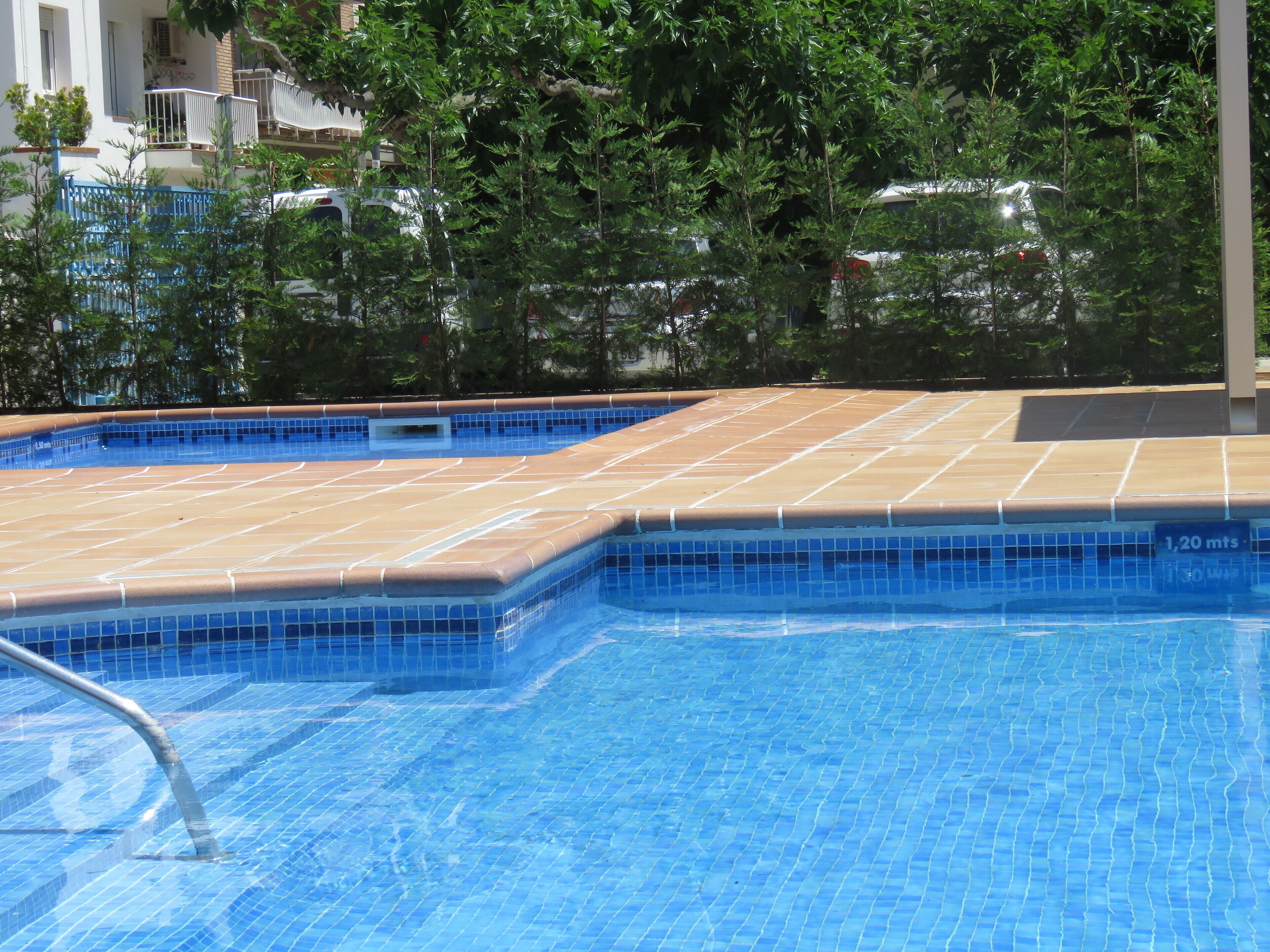 seasonal outdoor pool, pool umbrellas, pool loungers
