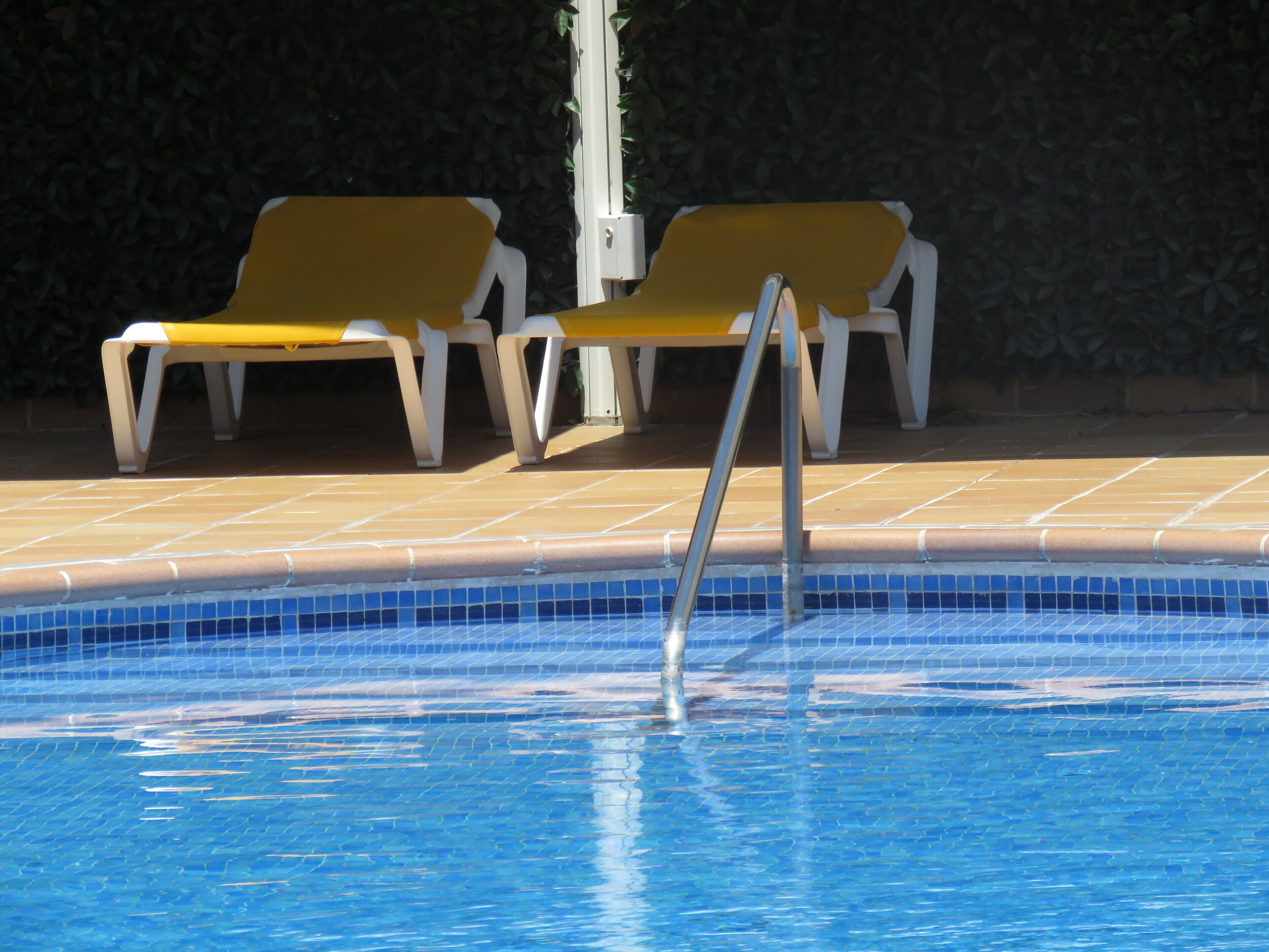 seasonal outdoor pool, pool umbrellas, pool loungers
