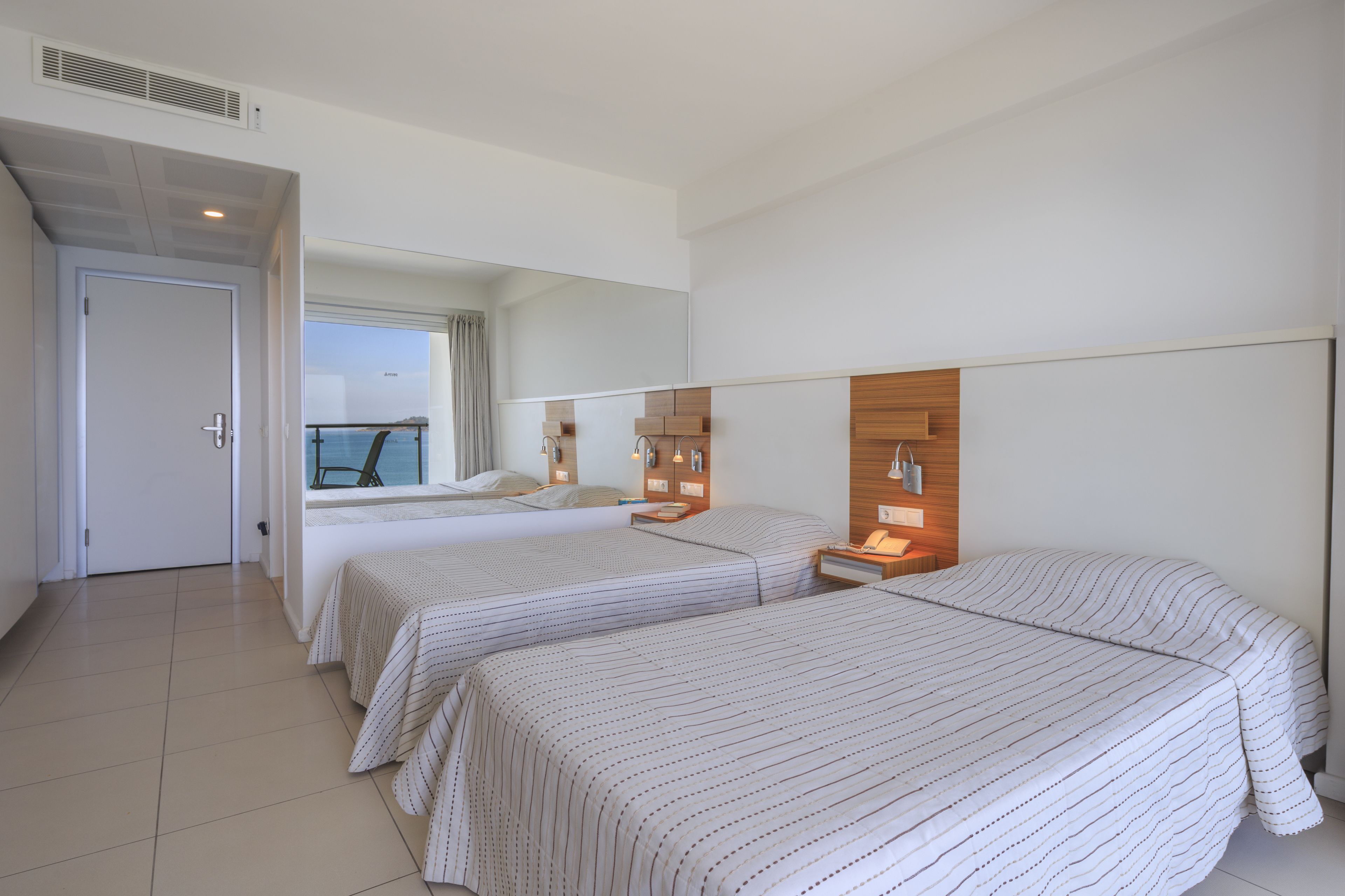 twin room, sea view | 1 bedroom, minibar, in-room safe, iron/ironing board