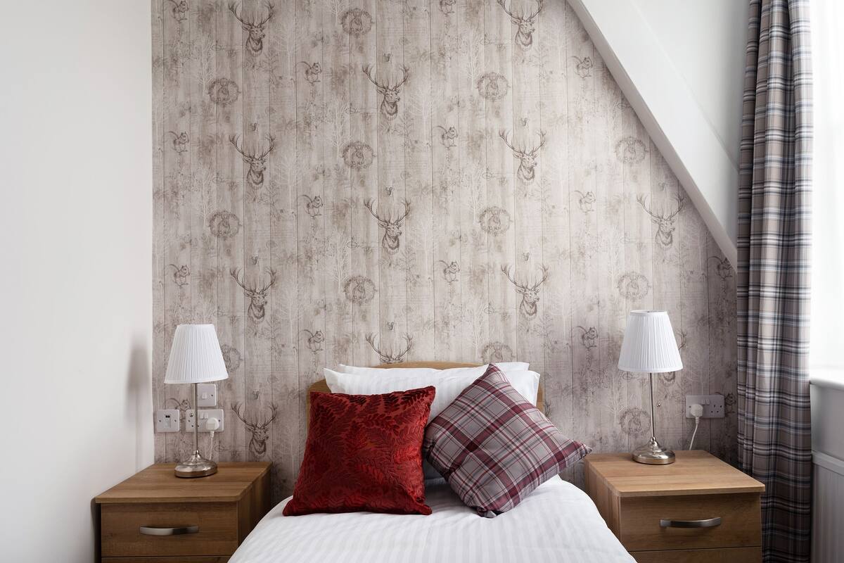 Desk, iron/ironing board (on request), bed sheets