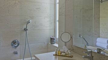 Designer toiletries, hair dryer, slippers, towels