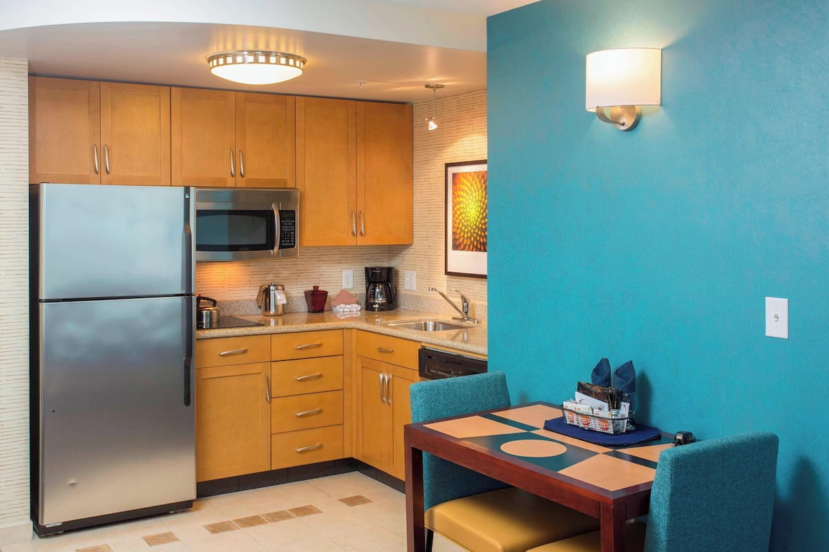 full-sized fridge, microwave, stovetop, dishwasher