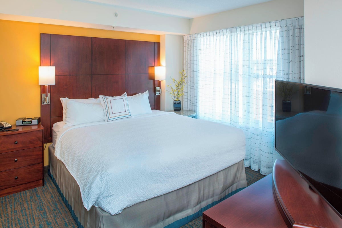 premium bedding, desk, blackout curtains, iron/ironing board