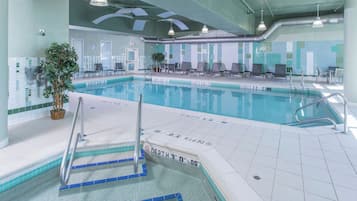 Indoor pool, open 6:00 AM to 11:00 PM, pool loungers