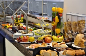 A buffet with various food items including fruits, vegetables, and pastries. - Holiday Inn Reynosa Zona Dorada by IHG (Reynosa)