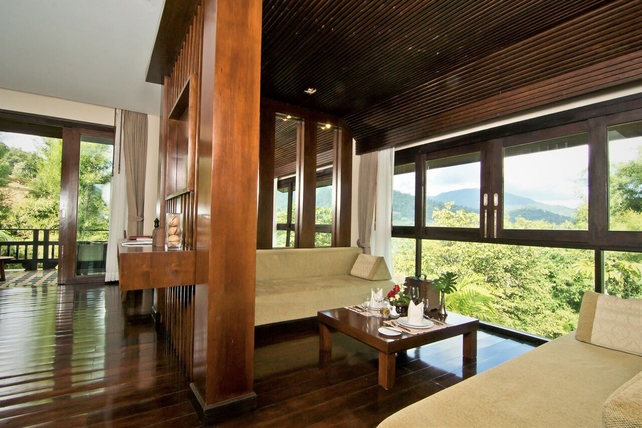 Mountain Deluxe Room | Living area | TV, fireplace, DVD player