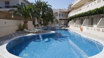 Seasonal outdoor pool, open 8:30 AM to 9:30 PM, pool umbrellas