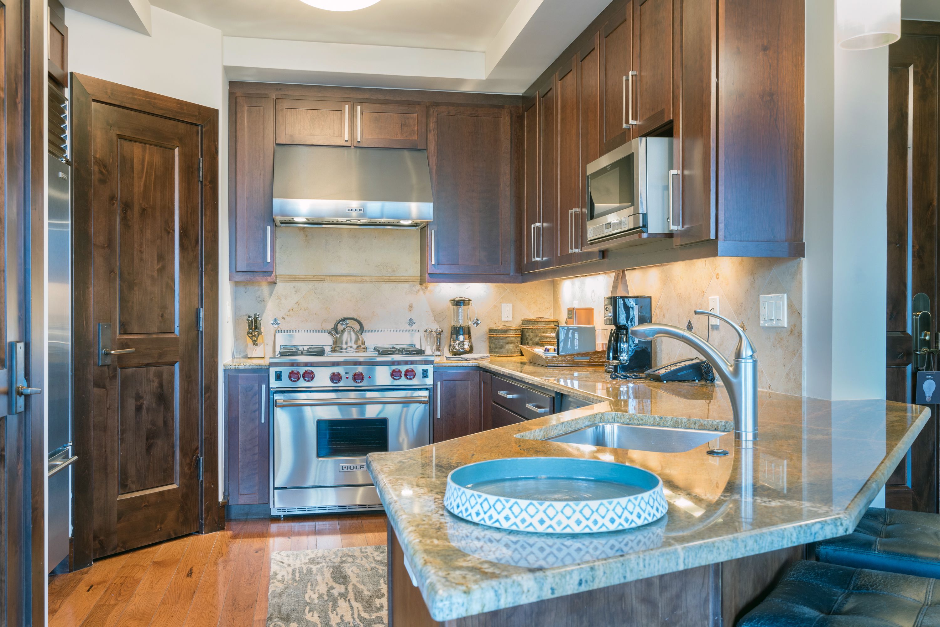 microwave, coffee/tea maker, cookware/dishes/utensils