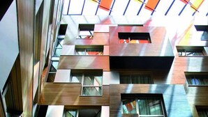 A multi-story building with a modern architectural design, featuring a combination of wooden and metal facades, multiple balconies, and large windows. - Hotel Silken Gran Teatro Burgos (Burgos)