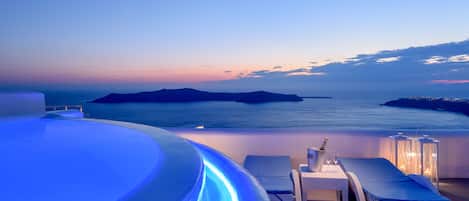 Outdoor pool, open 10:30 AM to 7:30 PM, pool umbrellas, pool loungers