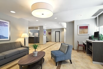 Sitting area in hotel lobby at Candlewood Suites New York City-Times Square by IHG