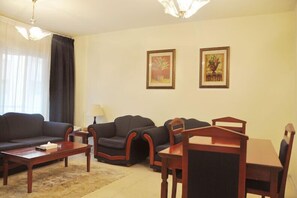 Deluxe Apartment, 2 Bedrooms | Living area | Flat-screen TV - Royal Plaza Hotel Apartments (Dubai)