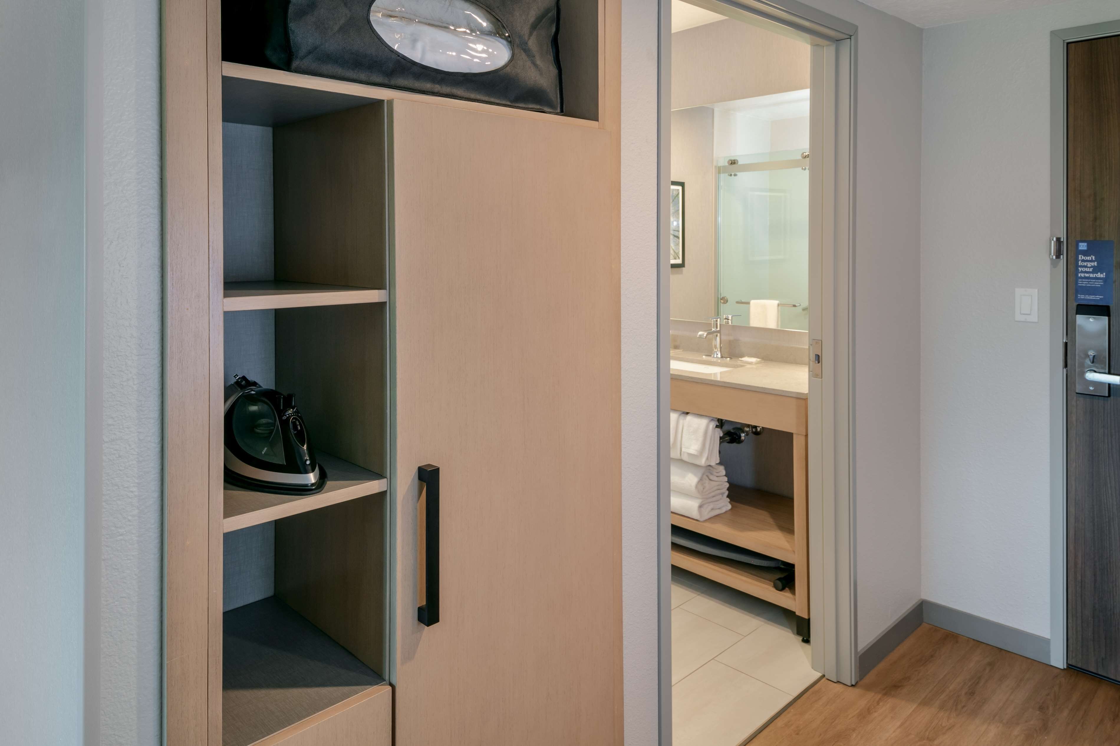 desk, laptop workspace, blackout curtains, iron/ironing board