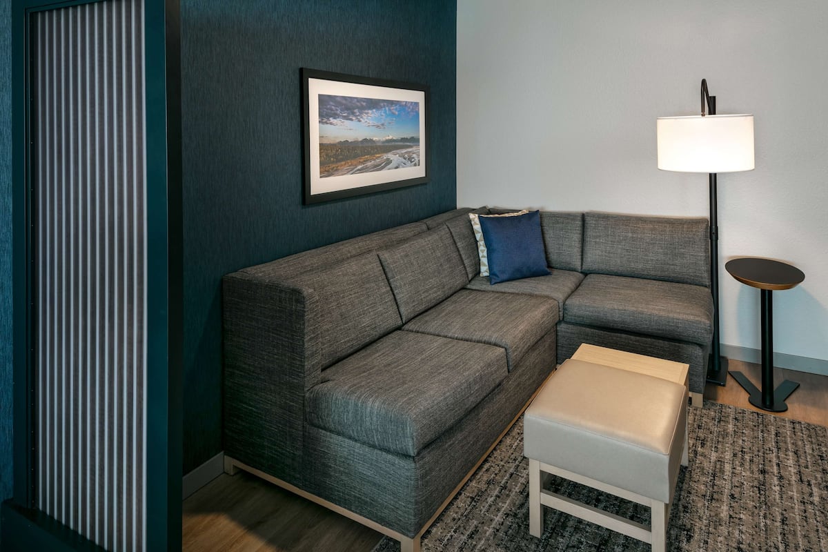 desk, laptop workspace, blackout curtains, iron/ironing board