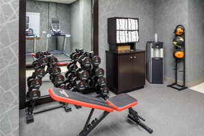 A gym with weightlifting equipment, treadmills, and a water dispenser. - Homewood Suites by Hilton Denver Tech Center (Englewood)