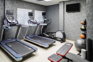 A fitness room with treadmills, an elliptical, a bench, and exercise balls. - Homewood Suites by Hilton Denver Tech Center (Englewood)