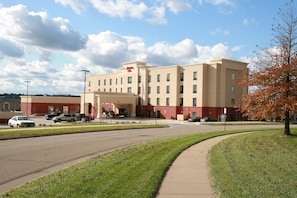 Hotel features a modern design with a flat roof and symmetrical facade.