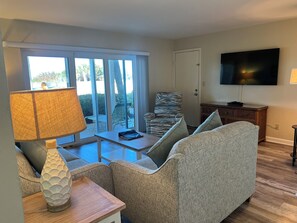 Two Bedroom (CAM-2) | Living area | Flat-screen TV, DVD player - Camelot by the Sea by Liberte' (St. Pete Beach)