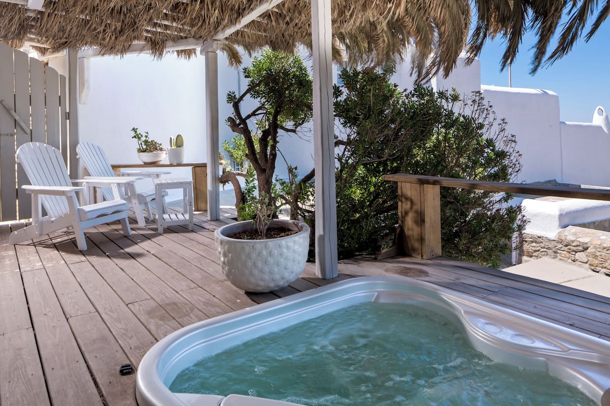 Junior Suite, Hot Tub, Sea View | 2 bedrooms, Egyptian cotton sheets, hypo-allergenic bedding