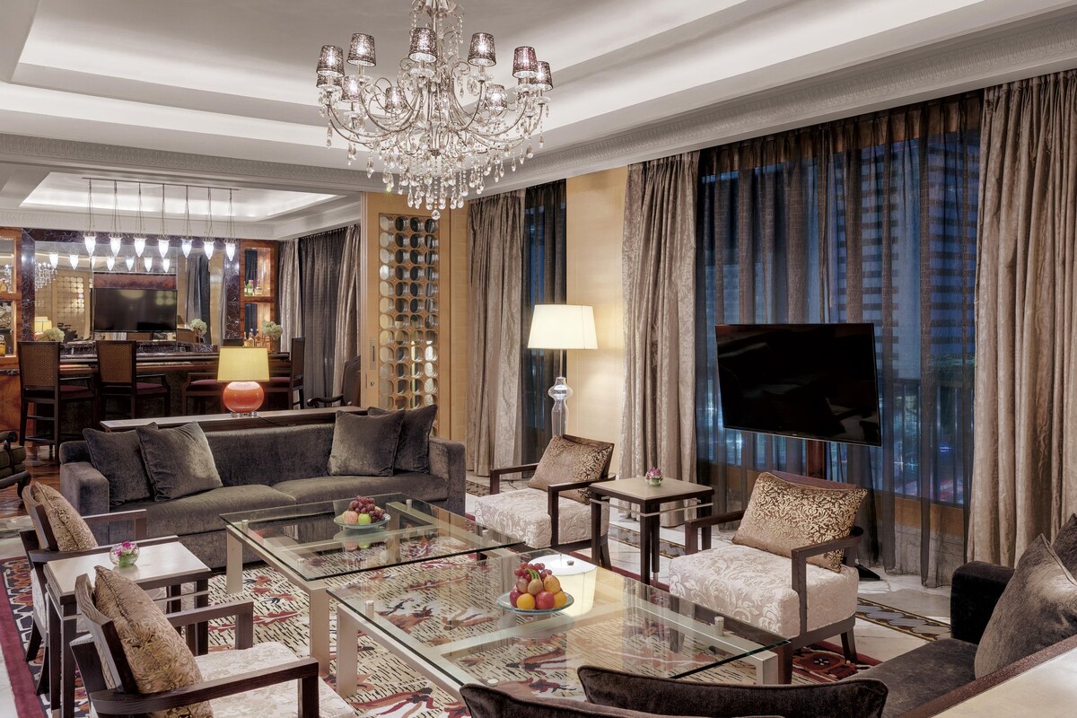 Suite, 1 King Bed, Smoking, City View | Living area | 48-inch flat-screen TV with cable channels, TV, pay films