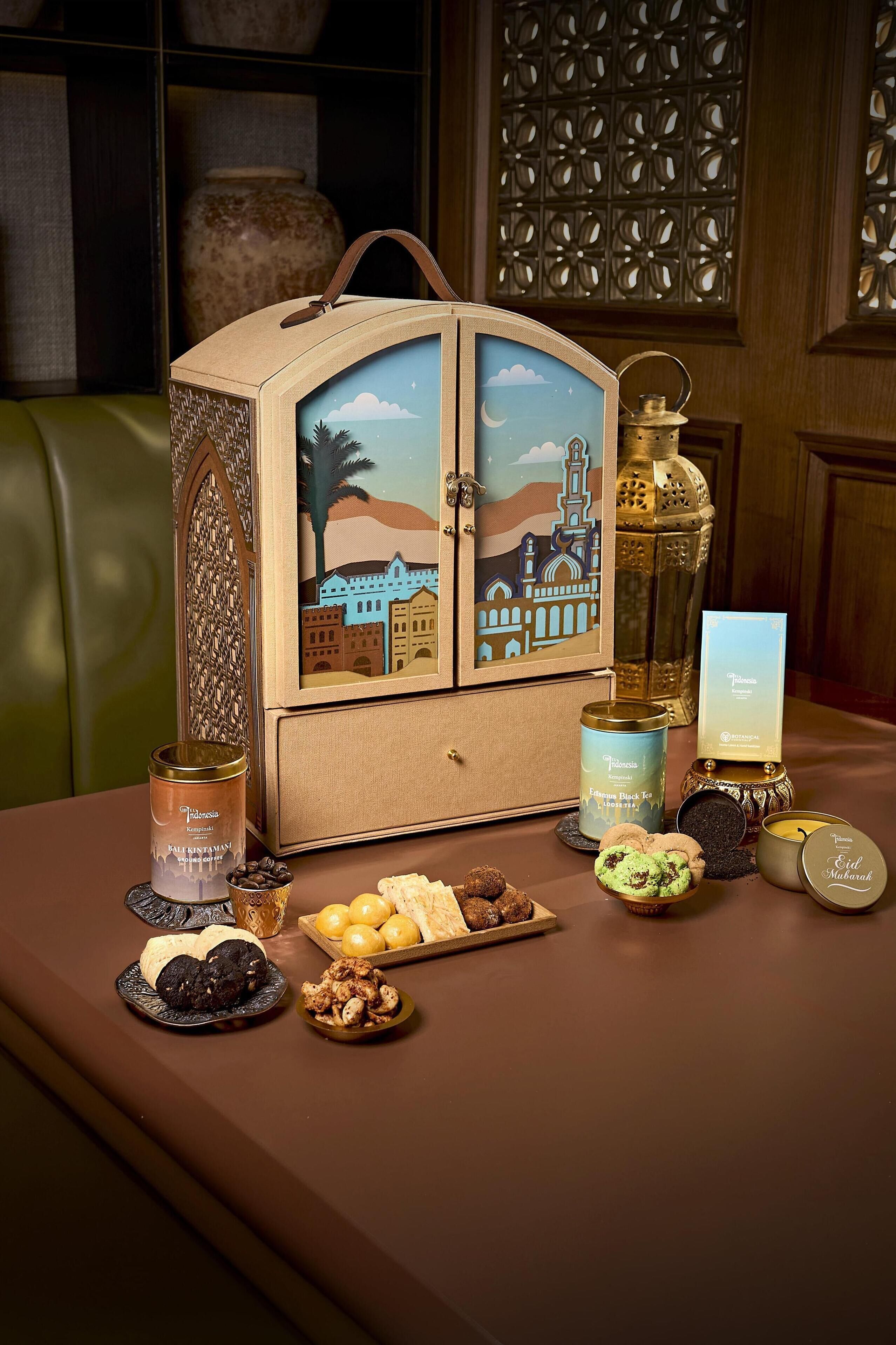 A table with a decorative cabinet, a lantern, and various food items.