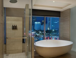 Separate tub and shower, deep soaking tub, eco-friendly toiletries