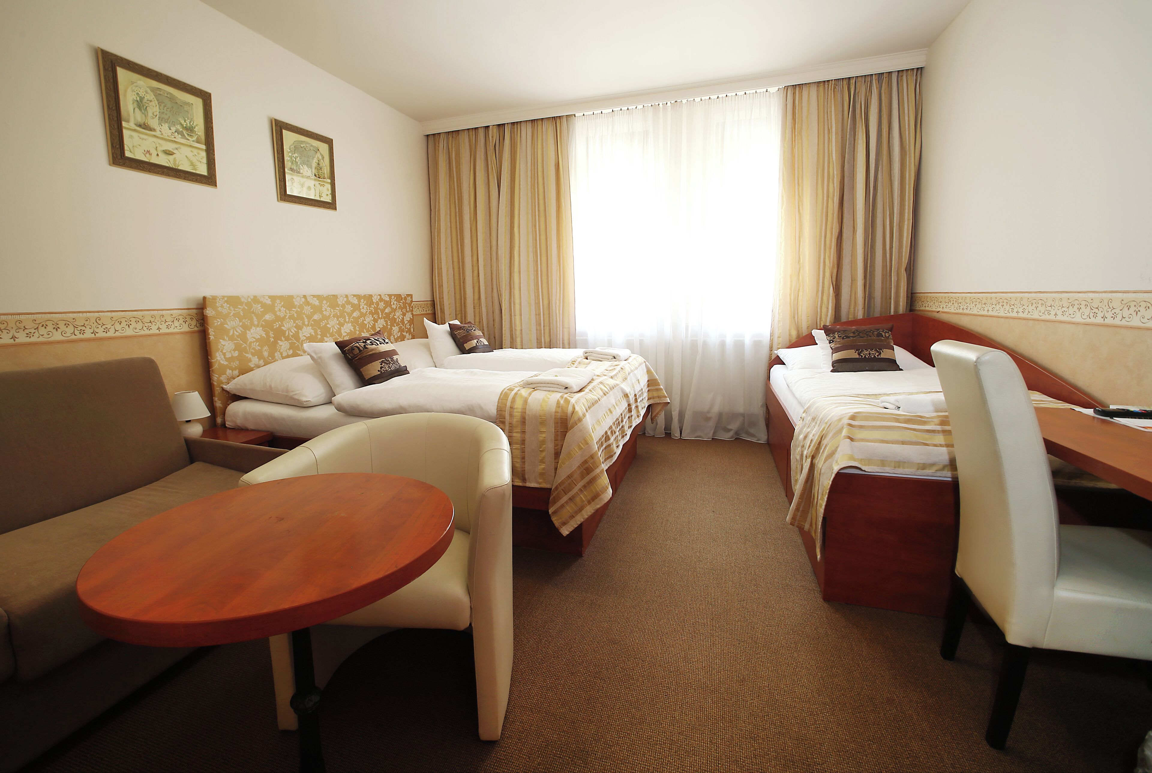 family room | 1 bedroom, minibar, in-room safe, desk