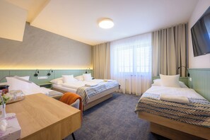 Quadruple Room | Minibar, in-room safe, desk, iron/ironing board - Hotel Roudna (Plzen)