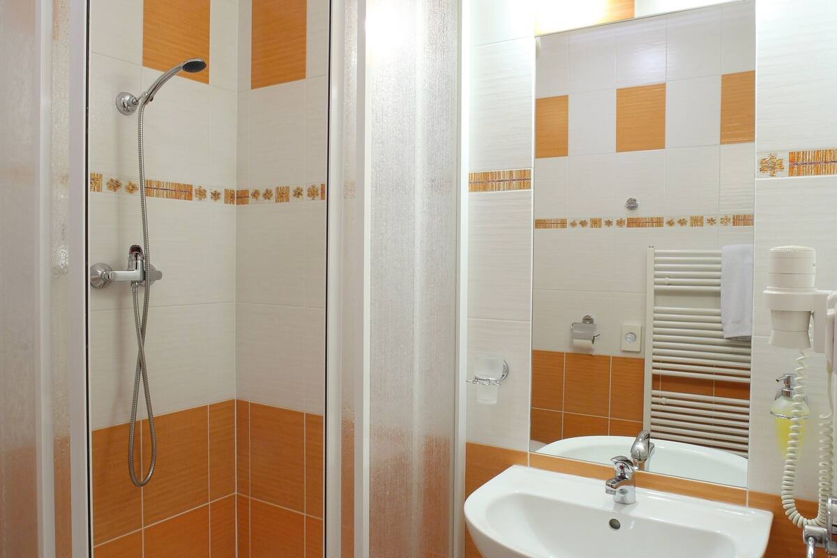 superior twin room | bathroom | hair dryer, towels