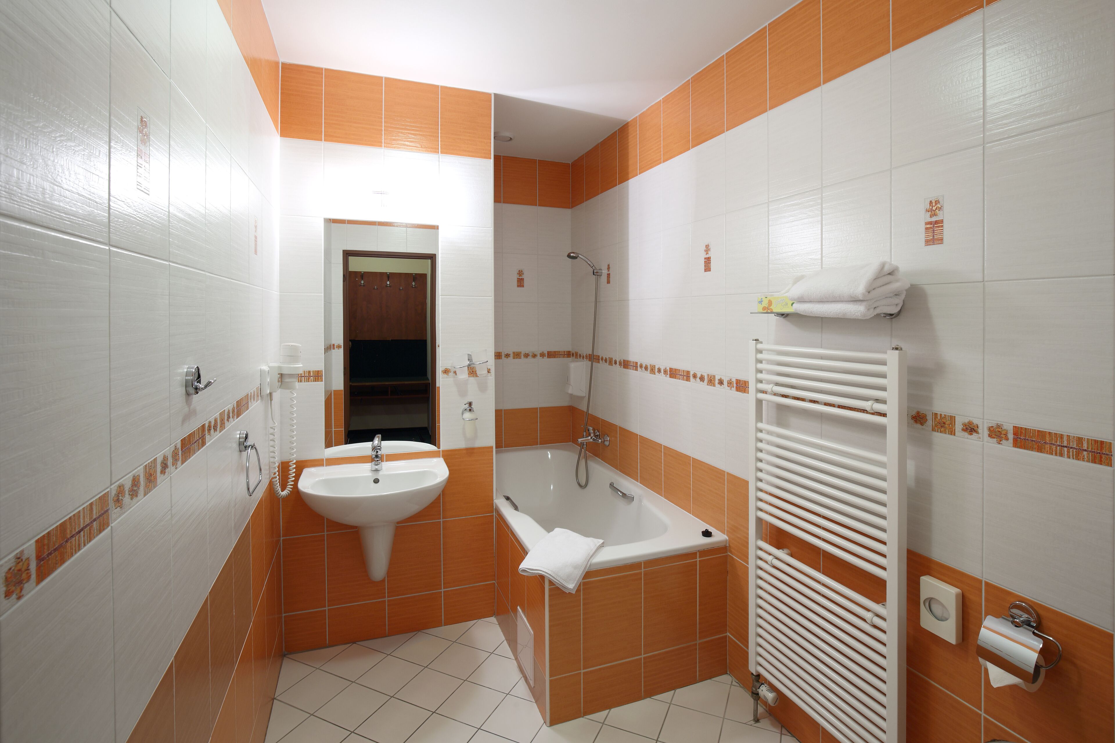 superior triple room | bathroom | hair dryer, towels