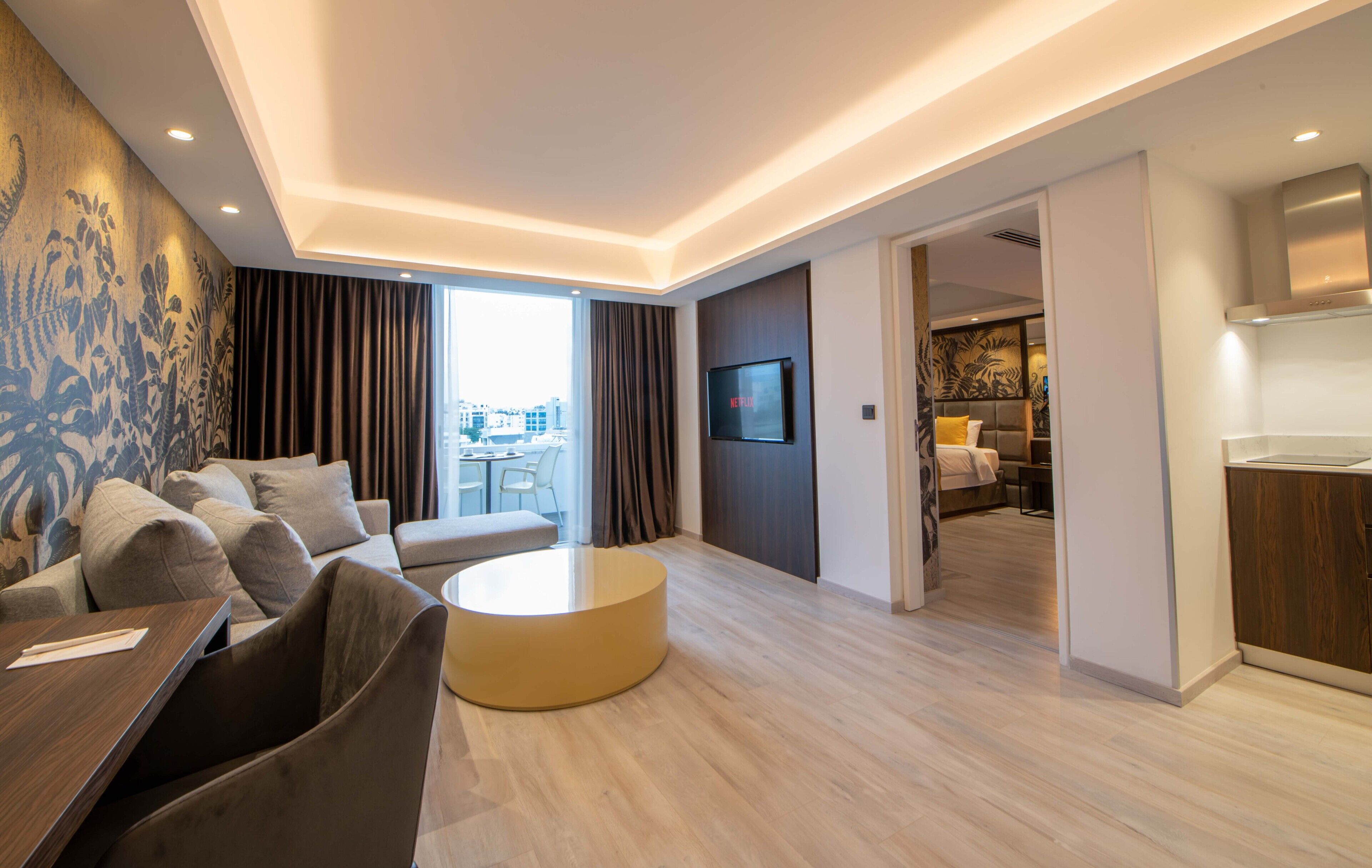 deluxe suite, 1 king bed | living room | 43-inch tv with satellite channels, netflix