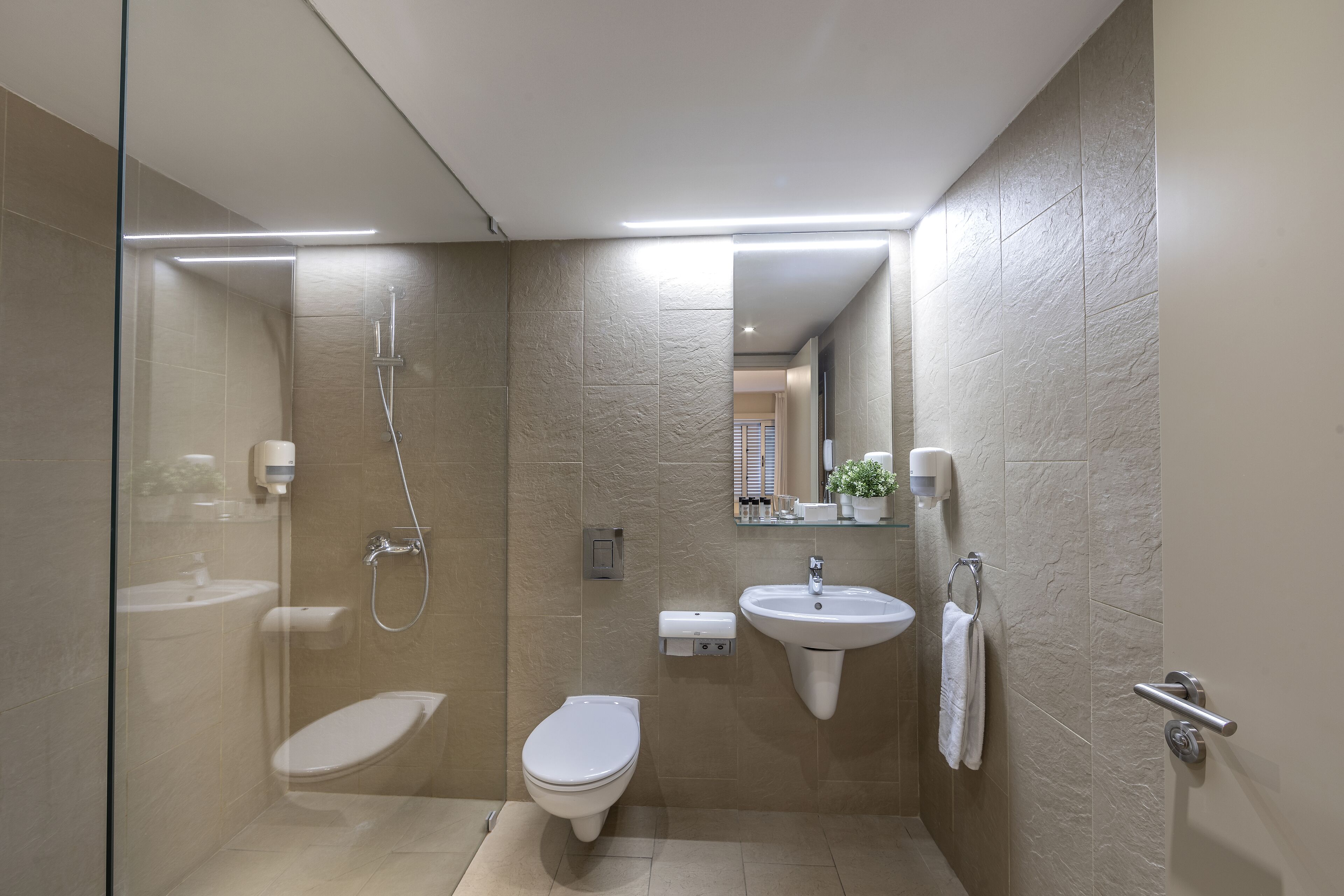 deluxe suite, 1 queen bed | bathroom | shower, rainfall showerhead, free toiletries, hair dryer