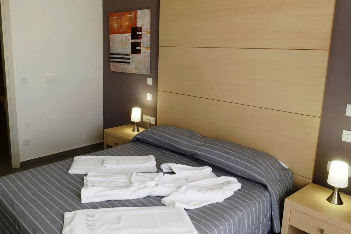 In-room safe, blackout drapes, iron/ironing board, bed sheets