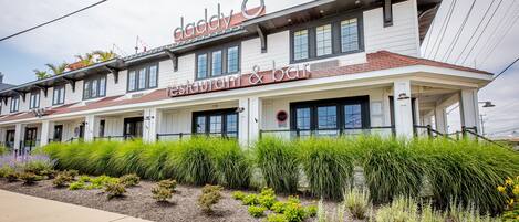 A two-story building with a sign reading "Daddy's Restaurant & Bar" on the ground floor.