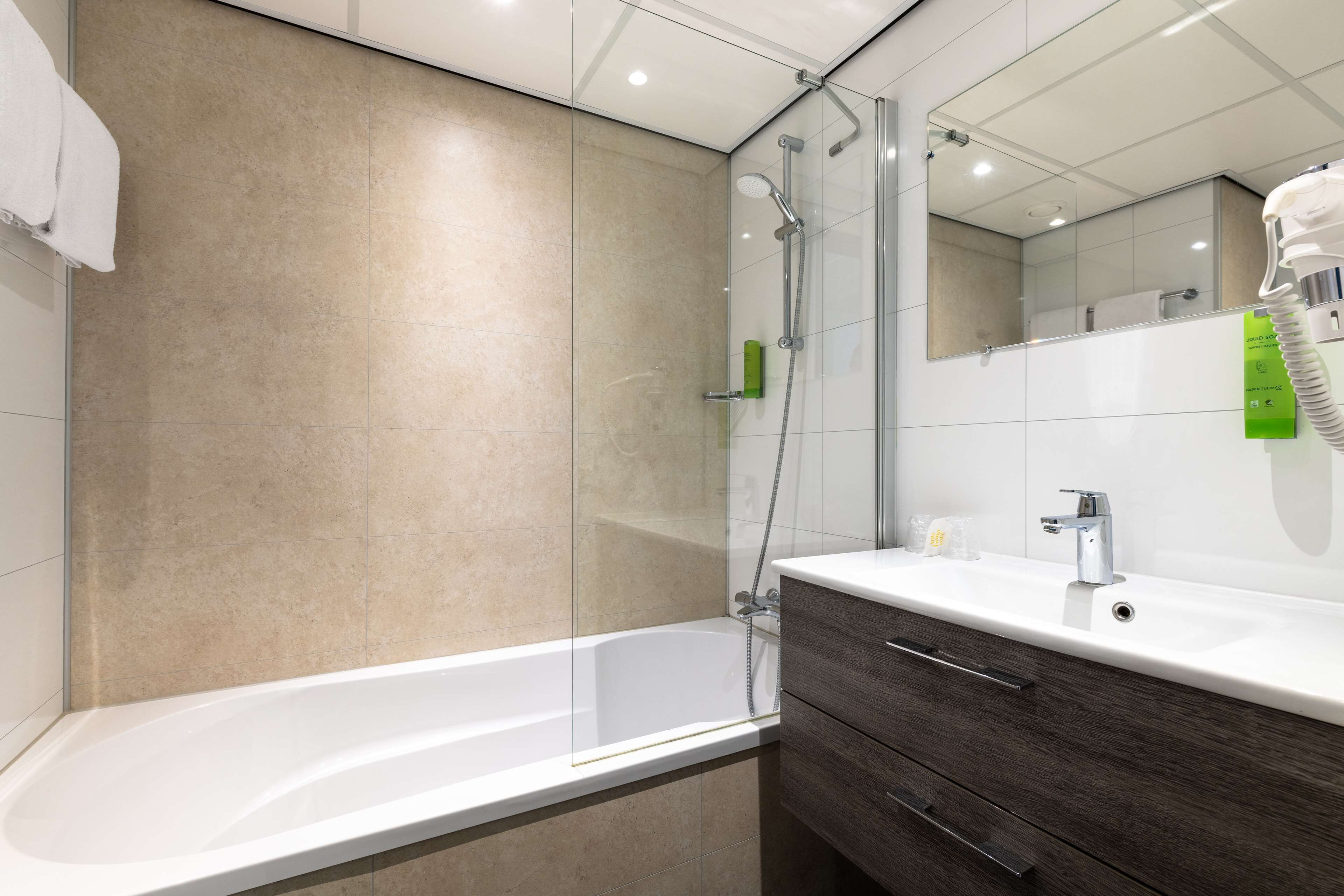 eco-friendly toiletries, hair dryer, towels, soap