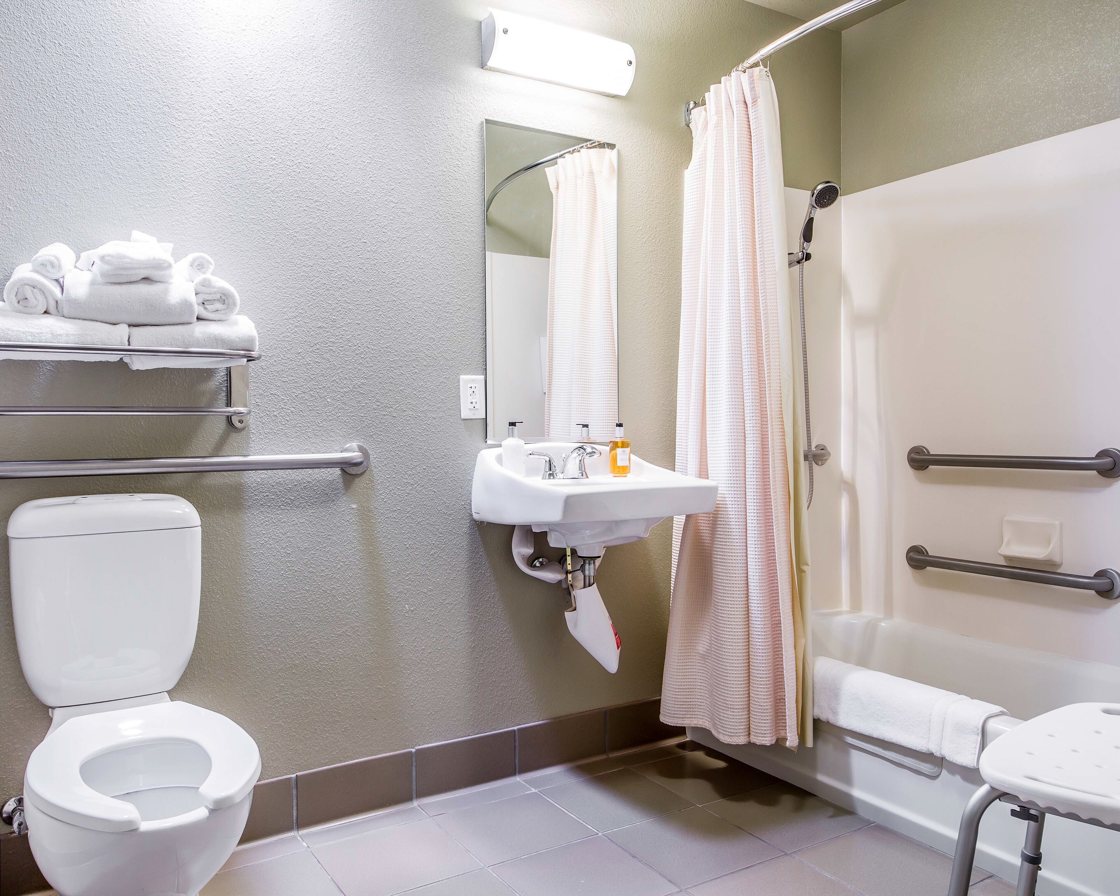 combined shower/bathtub, designer toiletries, hair dryer, towels