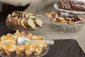 A buffet with various desserts including cakes and pastries. - Hotel Esplanade (Cesenatico)
