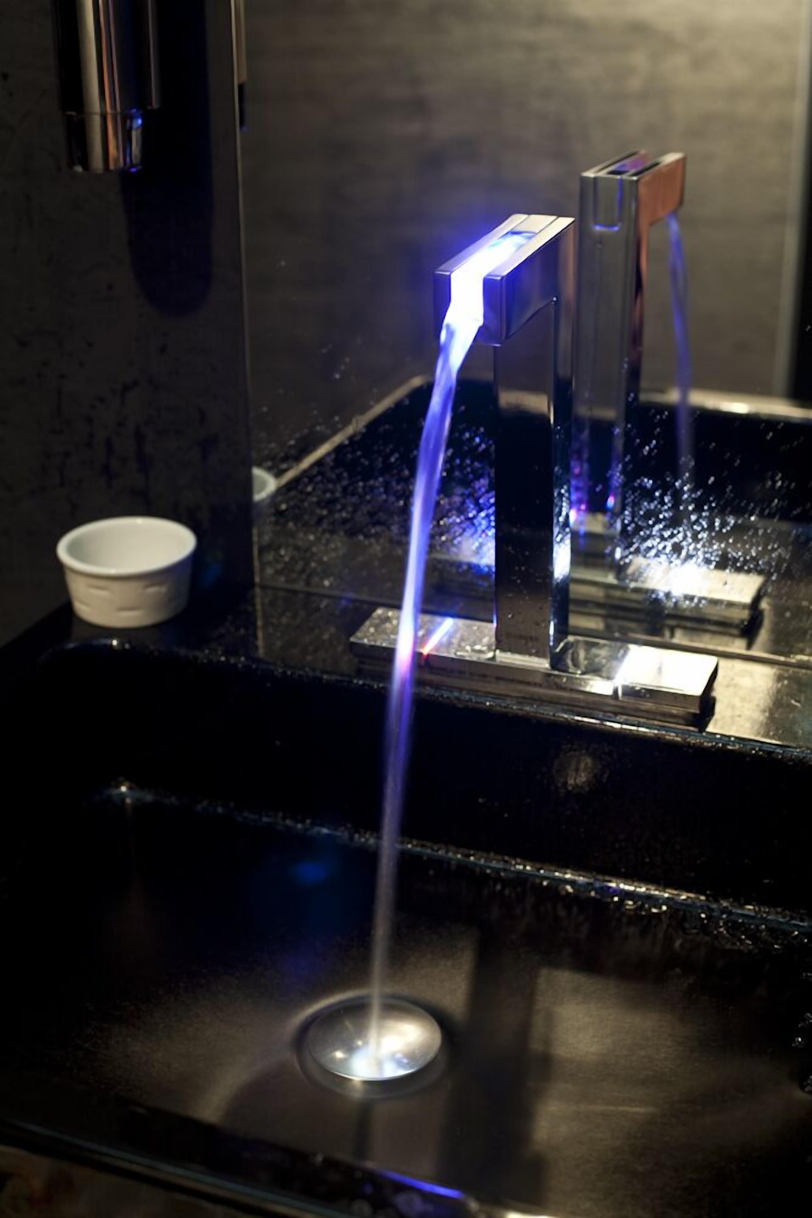 shower, hair dryer, slippers, towels