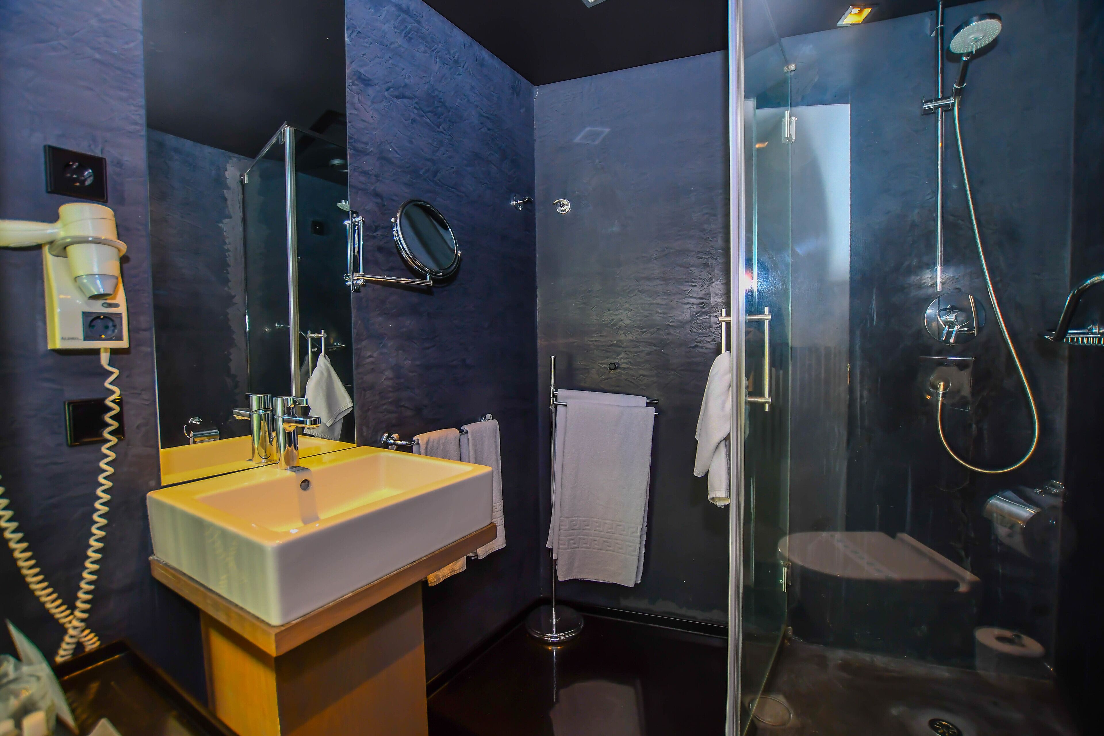 shower, hair dryer, slippers, towels