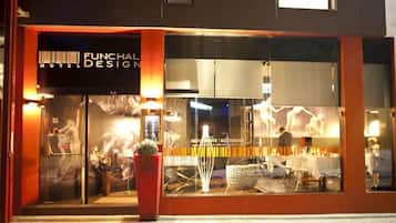 A hotel with a modern design, featuring a prominent sign for 'Funchaldesign Hotel'.