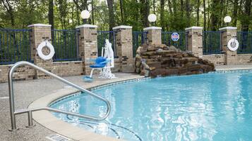Outdoor pool, open 6 AM to 10 PM, pool loungers