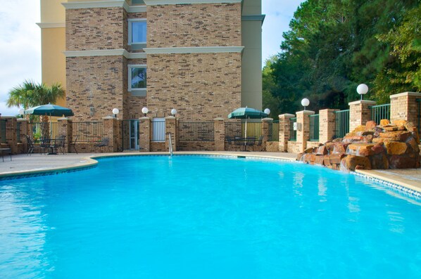 Outdoor pool, open 6 AM to 10 PM, pool loungers