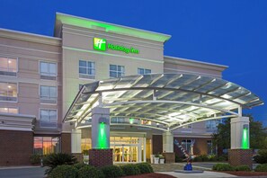 A Holiday Inn hotel with a covered entrance, multiple windows, and a brick facade. - Holiday Inn Statesboro-University Area by IHG (Statesboro)