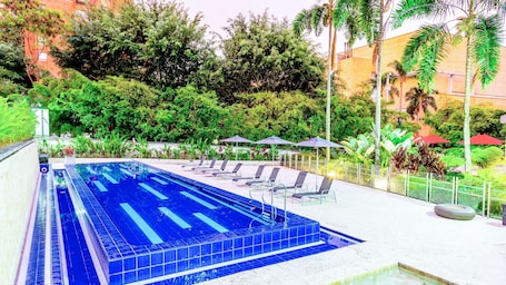 Outdoor pool, pool umbrellas, sun loungers