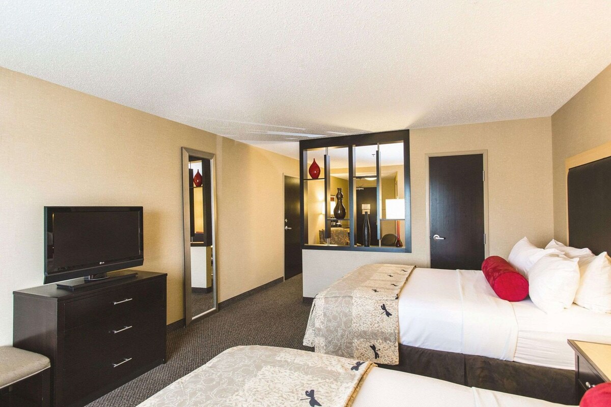 Premium bedding, desk, laptop workspace, blackout curtains
